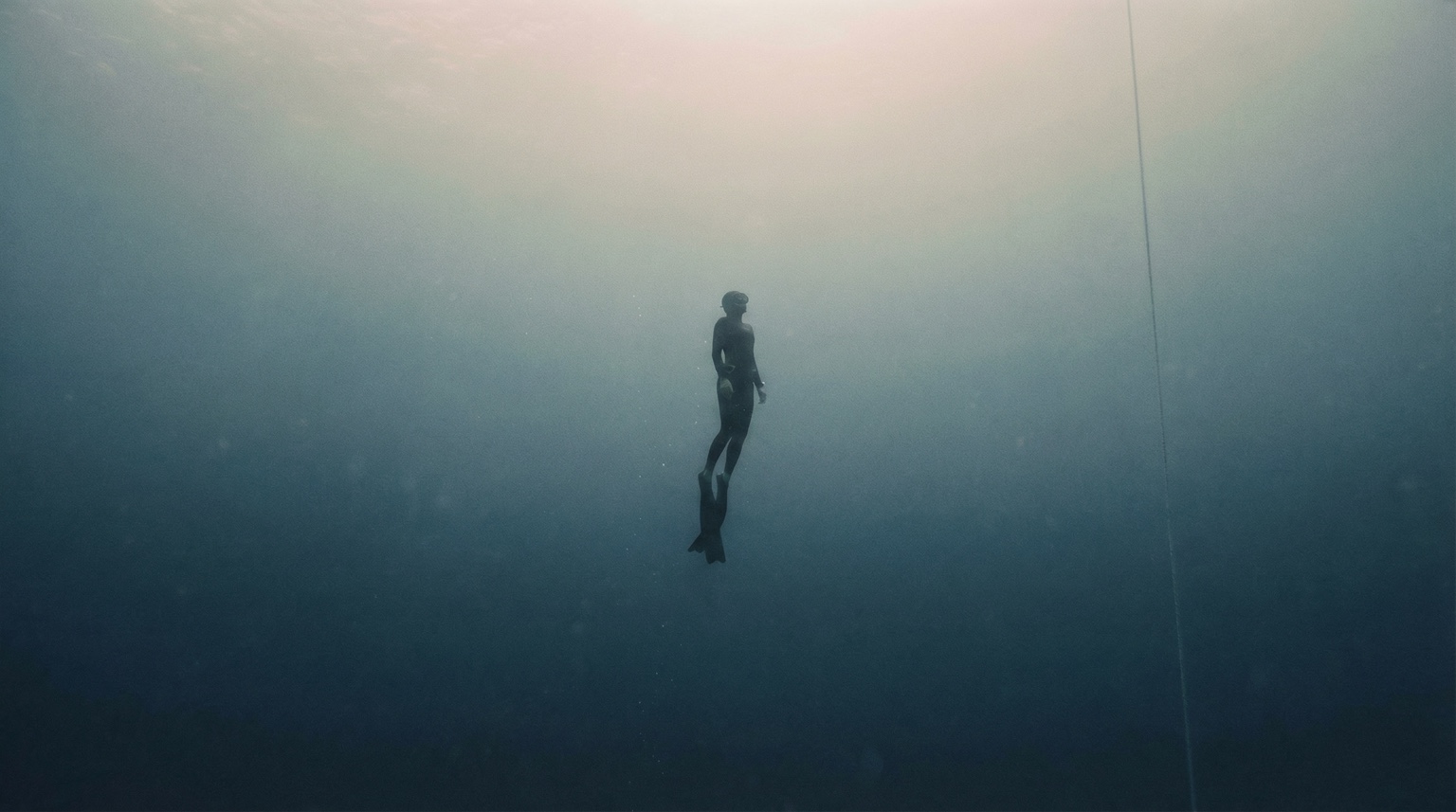 Surface Tension underwater key visual